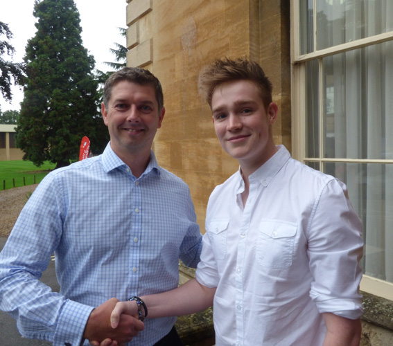 Headmaster congratulating Jordan